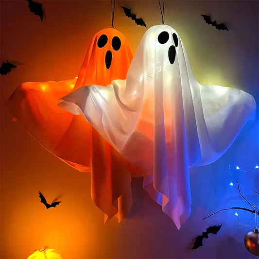 Two Halloween-themed ghost decorations with colorful lighting effects on a dark background.