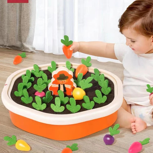 Child playing with a toy garden set on a wooden floor.