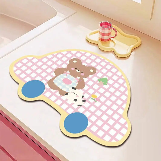 Children's mat with cartoon bear design on a kitchen counter