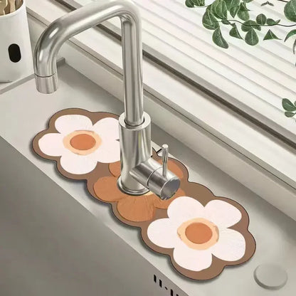 Flower-shaped mats on a kitchen sink with a faucet in the background