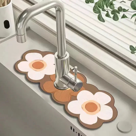 Flower-shaped mats on a kitchen sink with a faucet in the background