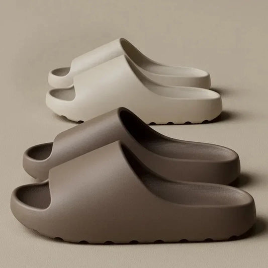 Pair of gray clogs on a beige background