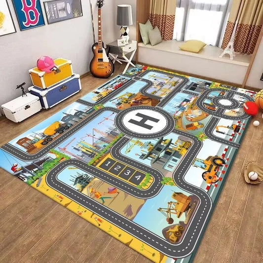 Children's play rug with construction-themed design on a wooden floor.