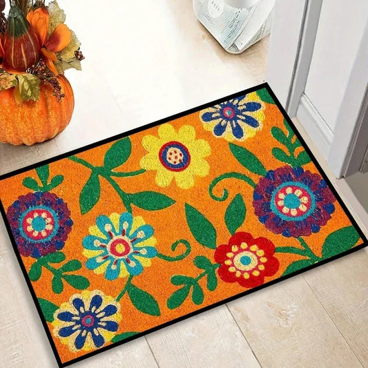 Colorful floral doormat on a wooden floor with pumpkins.