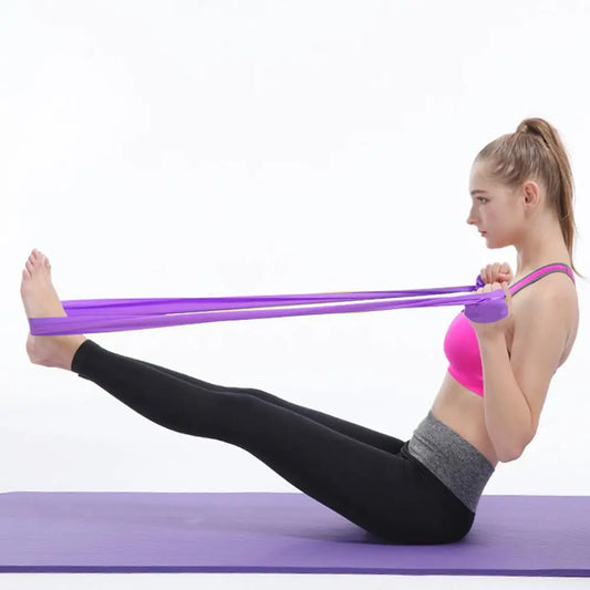 Woman exercising with a resistance band on a white background