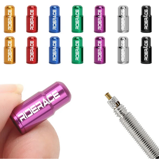Colorful RIDERACE valve stem caps with a hand holding a pink cap and a valve stem in the background.