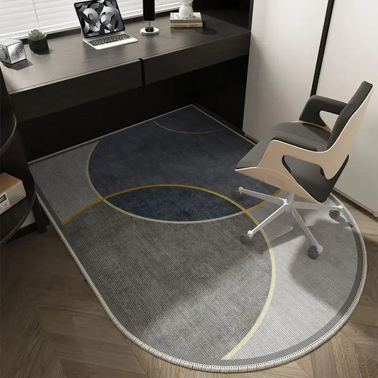 Modern office setup with a gray rug, chair, and desk.