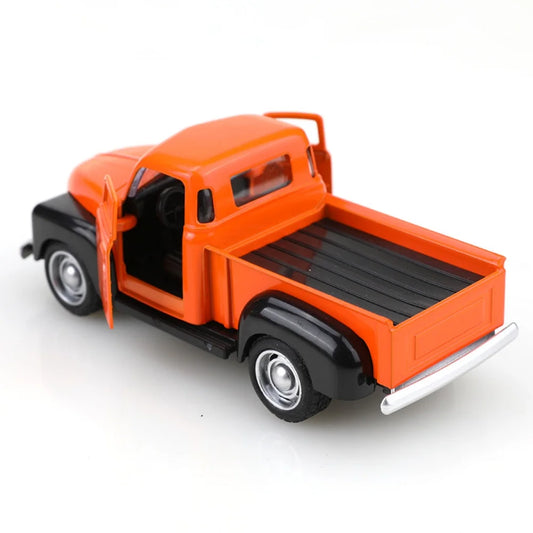 Model of an orange and black pickup truck on a white background