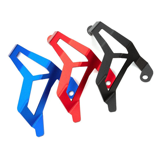 Three metal bottle cages in blue, red, and black on a white background