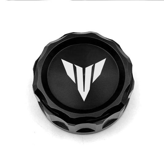 Black metal cap with a white logo on a white background