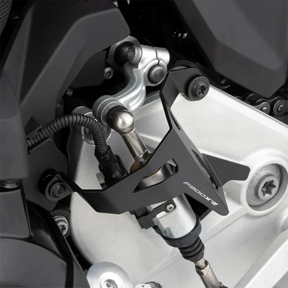 Close-up of a motorcycle suspension system with 'Fabbrica' branding.