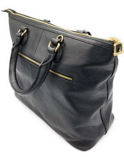 Black leather handbag with gold zippers on a white background