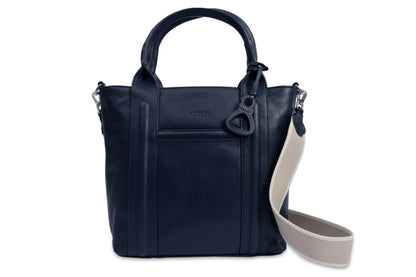 Navy blue handbag with a beige strap on a white background