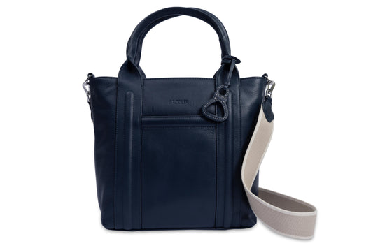 Navy blue handbag with a beige strap on a white background