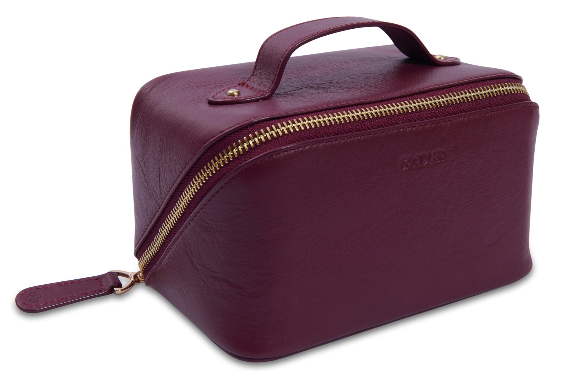 Maroon toiletry bag with gold zipper on a white background