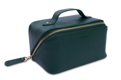 Green toiletry bag with gold zipper on a white background