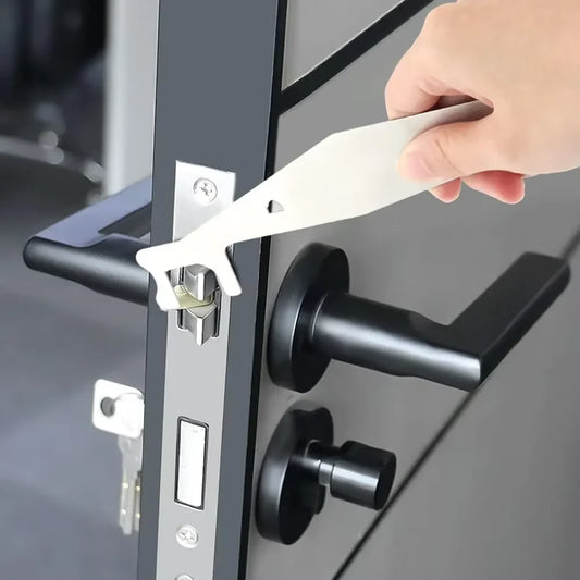 Hand using a lock pick tool on a door handle