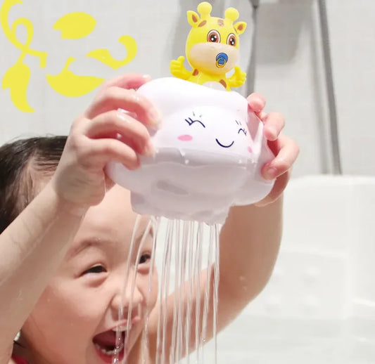 Child holding a cloud-shaped toy with water coming out, against a light background.