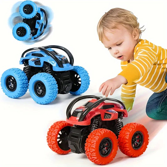 Child playing with two toy cars, one blue and one red, on a white background.