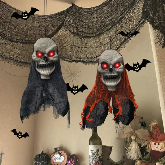 Halloween-themed decorations with ghost heads, bats, and a bottle on a neutral background.
