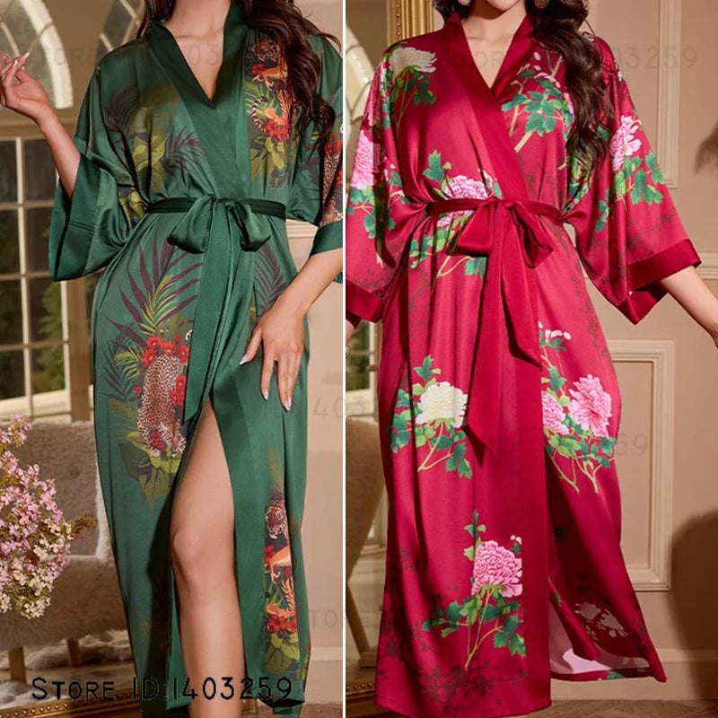 Two women wearing floral-patterned robes, one green and one red, in a home setting.