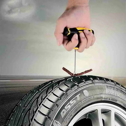 Hand using a tire pressure gauge on a car tire with a blurred background
