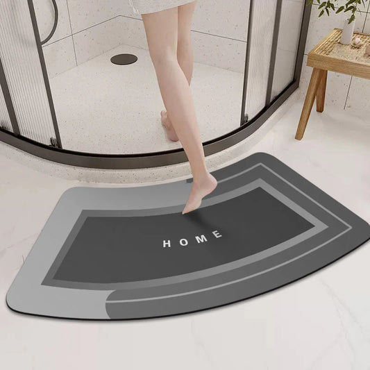 Person stepping onto a gray bath mat with 'HOME' text in a bathroom setting.