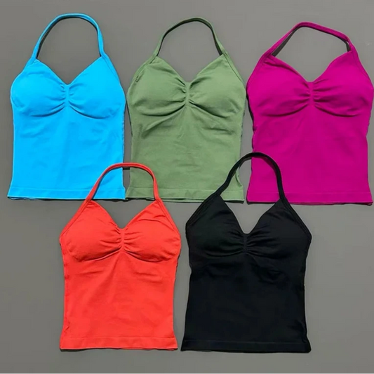 Five colorful tank tops in blue, green, pink, red, and black on a gray background.