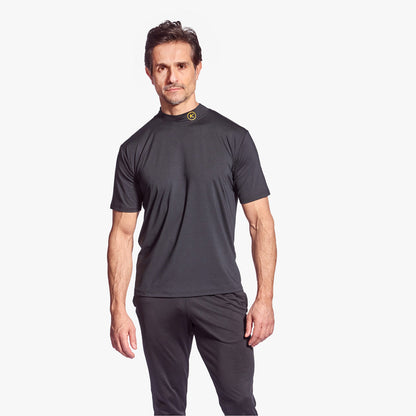 Man wearing a dark gray athletic outfit on a white background