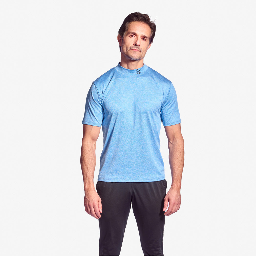 Man wearing a blue athletic shirt and black shorts on a white background