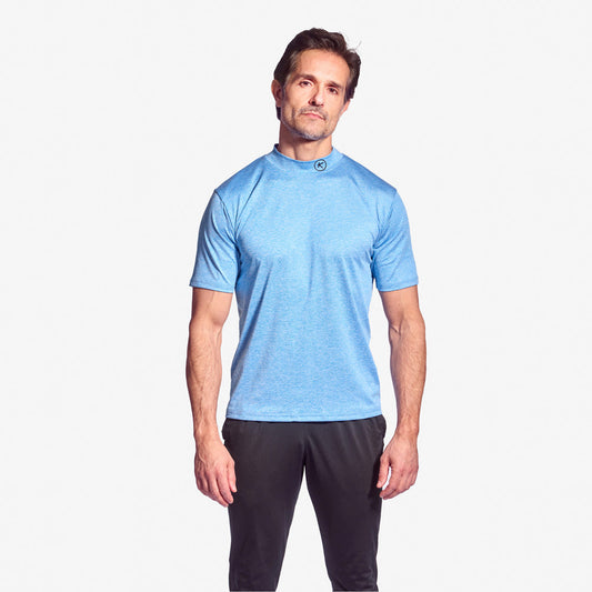 Man wearing a blue athletic shirt and black shorts on a white background