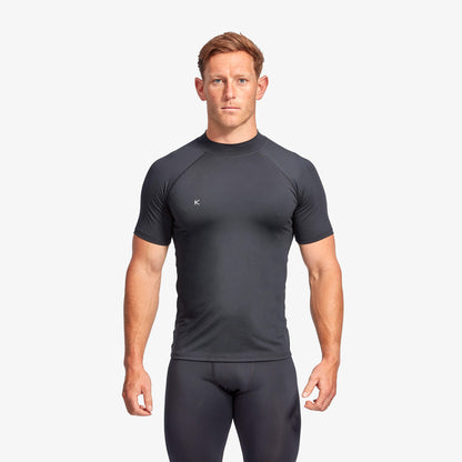 Man wearing a black athletic outfit on a white background