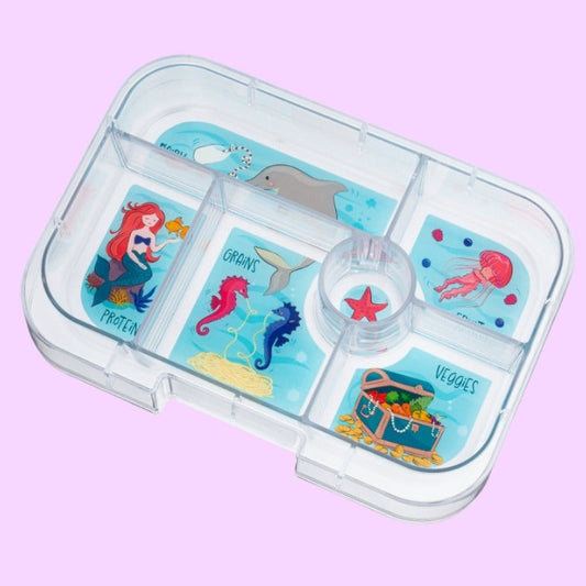Children's snack container with mermaid and sea creature illustrations on a pink background