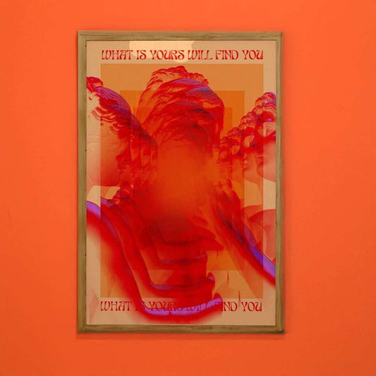 Framed artwork with a red and orange color scheme on an orange wall.