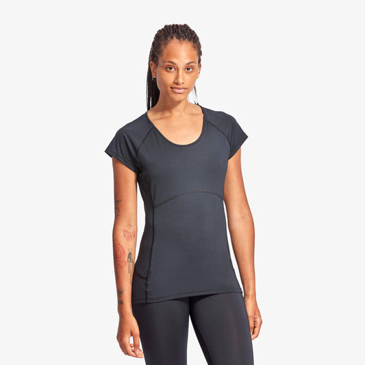 Woman wearing a black athletic outfit on a white background