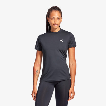 Person wearing a black athletic outfit with a logo on a white background