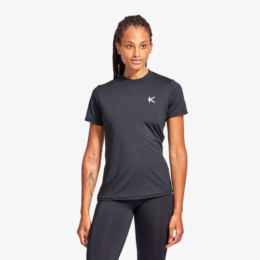Person wearing a black athletic outfit with a logo on a white background