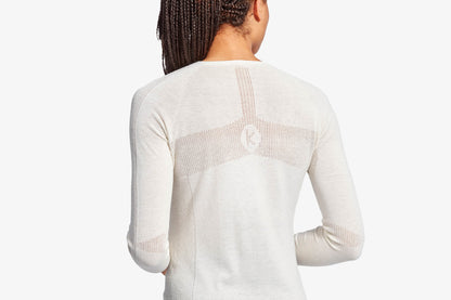 White long-sleeve top with mesh panels on a white background