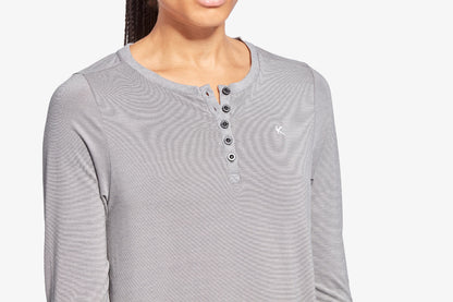 Gray long-sleeve henley shirt worn by a person on a white background