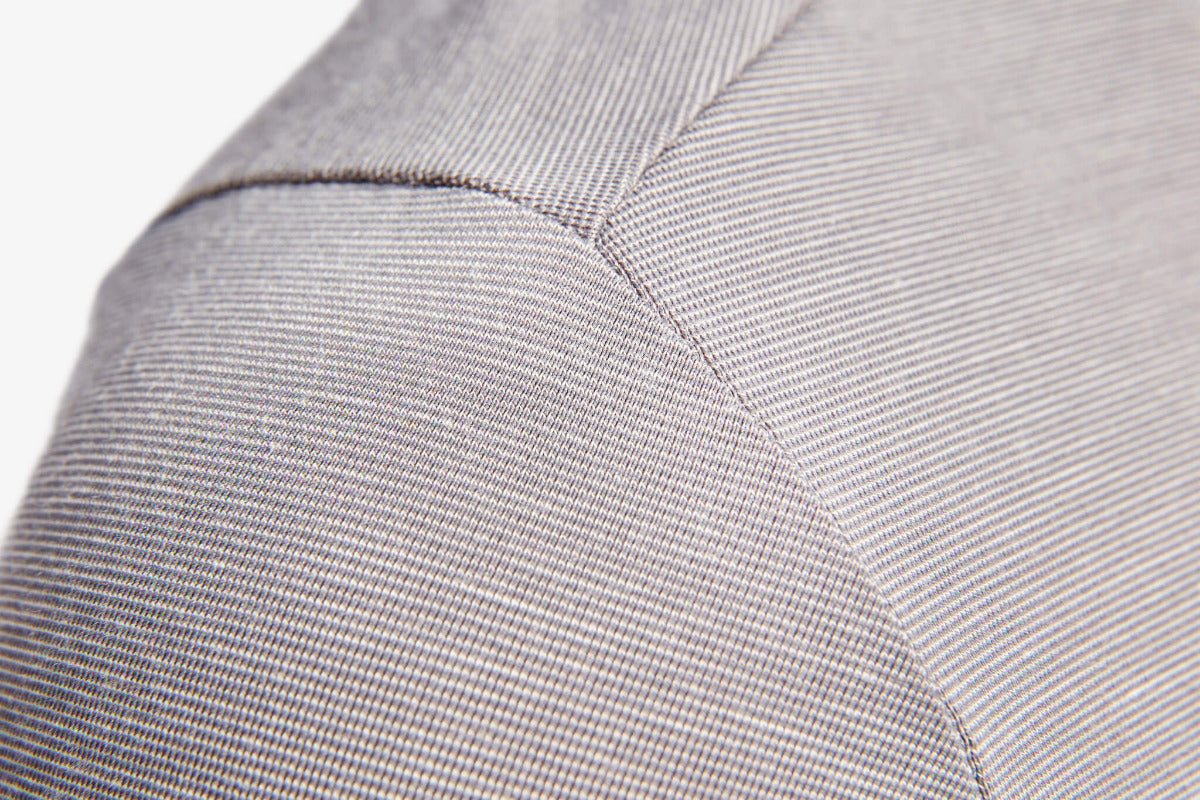 Close-up of a gray textured fabric with a subtle pattern