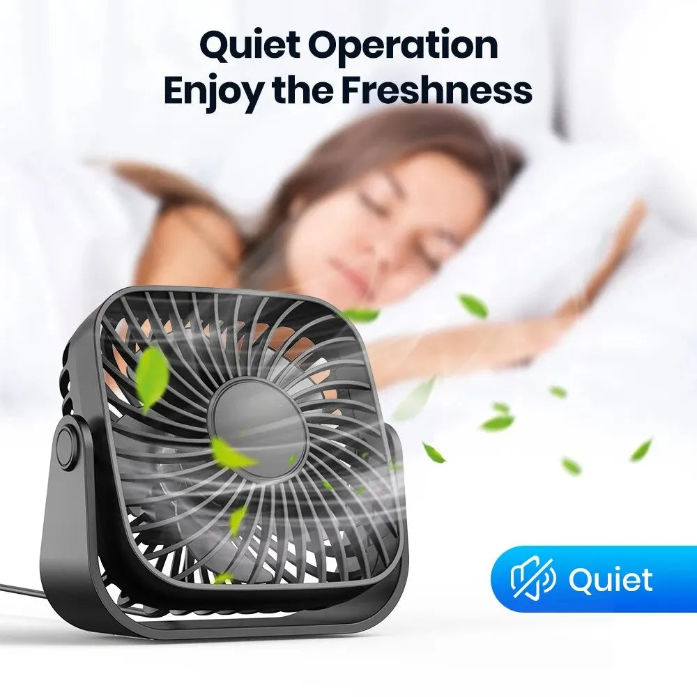 Portable fan with text 'Quiet Operation Enjoy the Freshness' and a person sleeping in the background.
