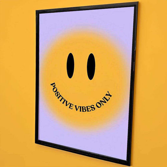 Framed artwork with a smiley face and 'Positive Vibes Only' text on a yellow background