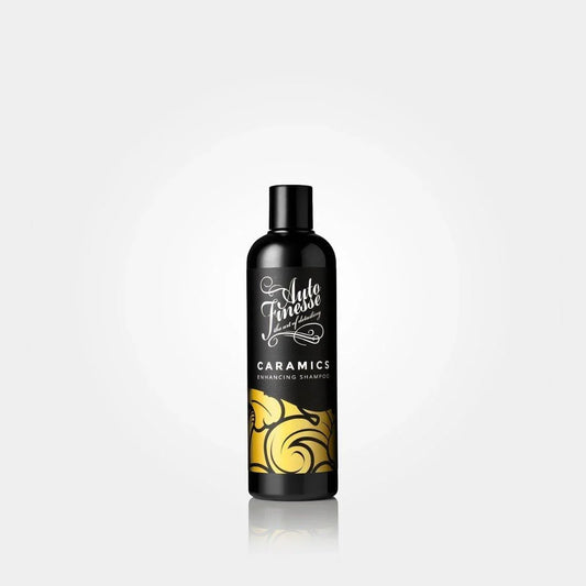 Bottle of Caramics shampoo with black and gold design on a white background