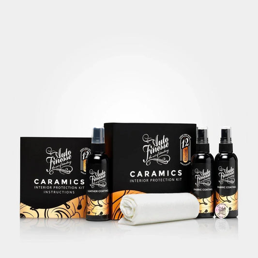 Caramics interior protection kit with bottles and a towel on a white background