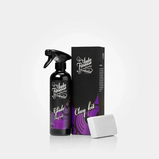 Car care product set with spray bottle, box, and bar of soap on a white background
