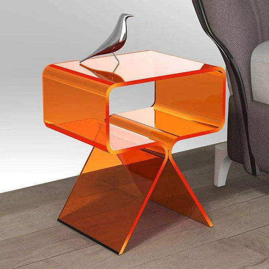 Orange transparent side table with a modern design on a wooden floor.