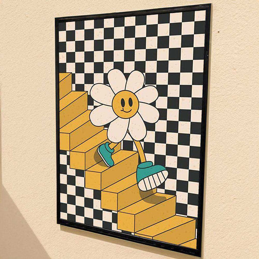 Framed artwork of a smiling flower character on yellow blocks with a checkered background.