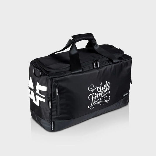 Black duffel bag with 'Auto Fitness' branding on a light gray background
