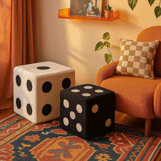 Two cube-shaped ottomans with dice design in a living room setting.