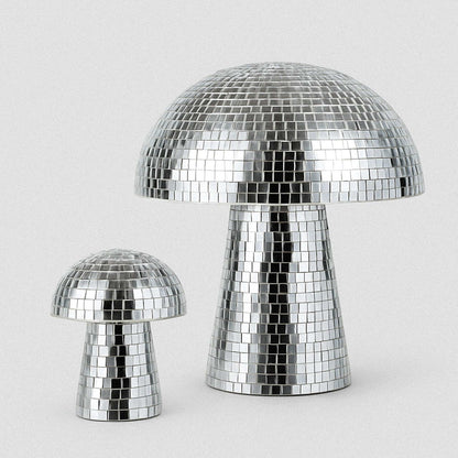 Two silver disco mushroom lamps on a light gray background
